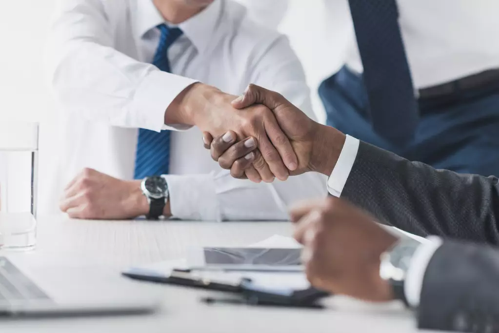 Business Professionals Shaking Hands Over a Contract